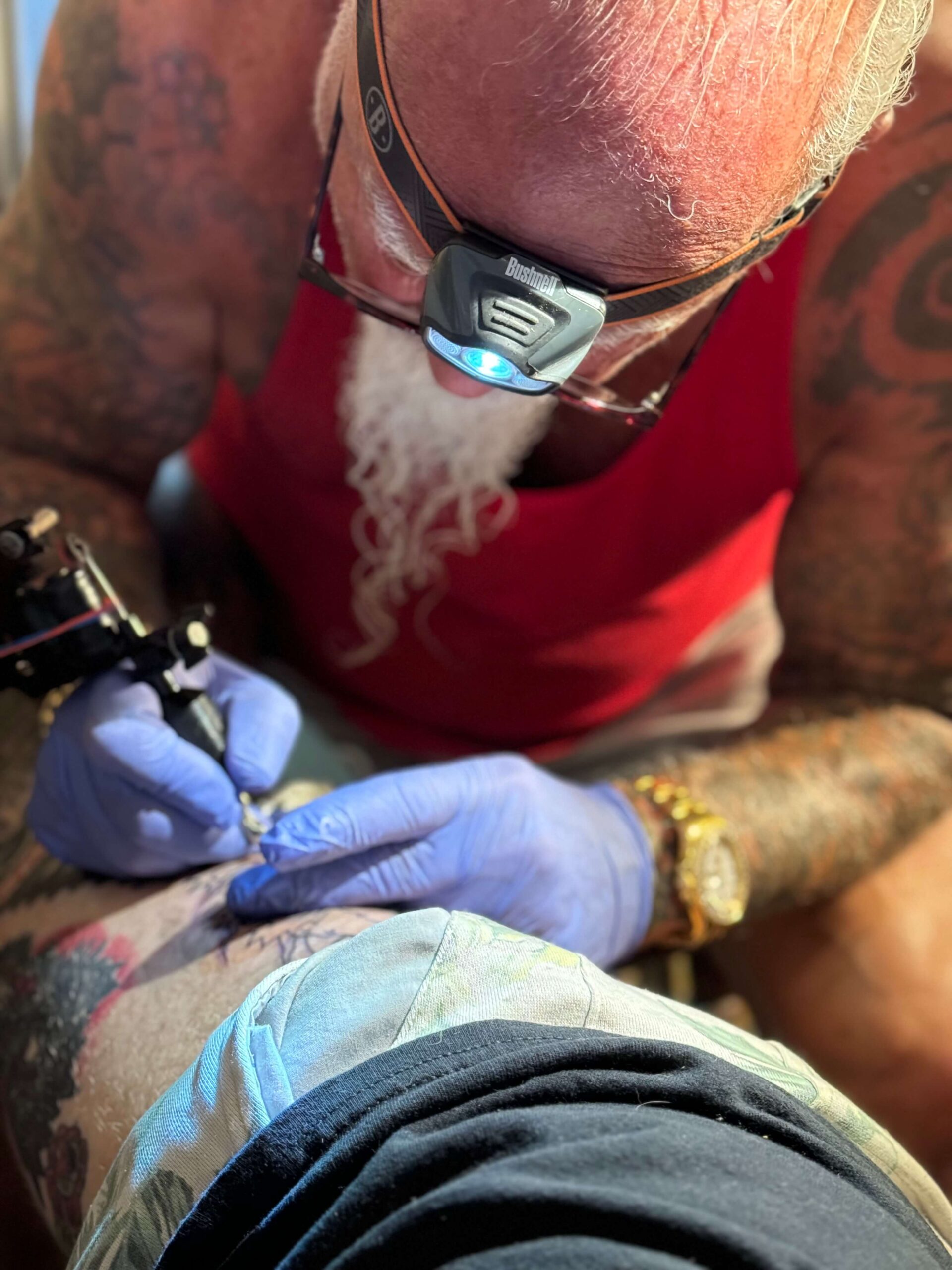 Larry Edwards tattooing at Atomic Tattoo.